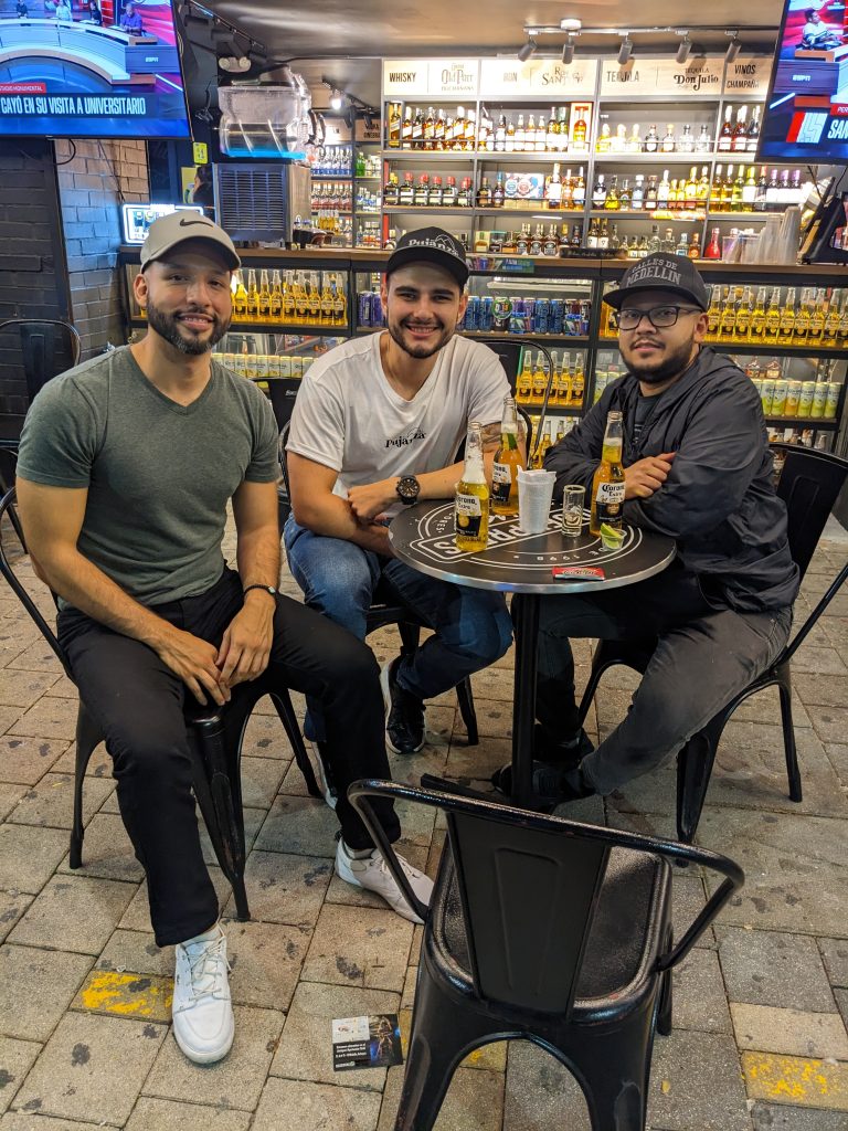 Juan, employee, and me on la 70 in Laureles